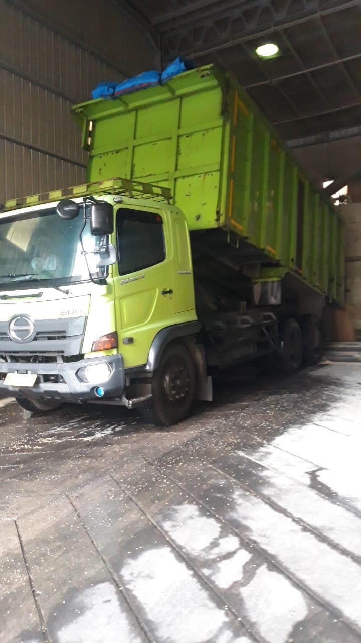 PAL green cargo truck documentation inside warehouse